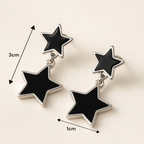 Boucles d'oreilles pendantes double étoile noires pour look moderne chic femme