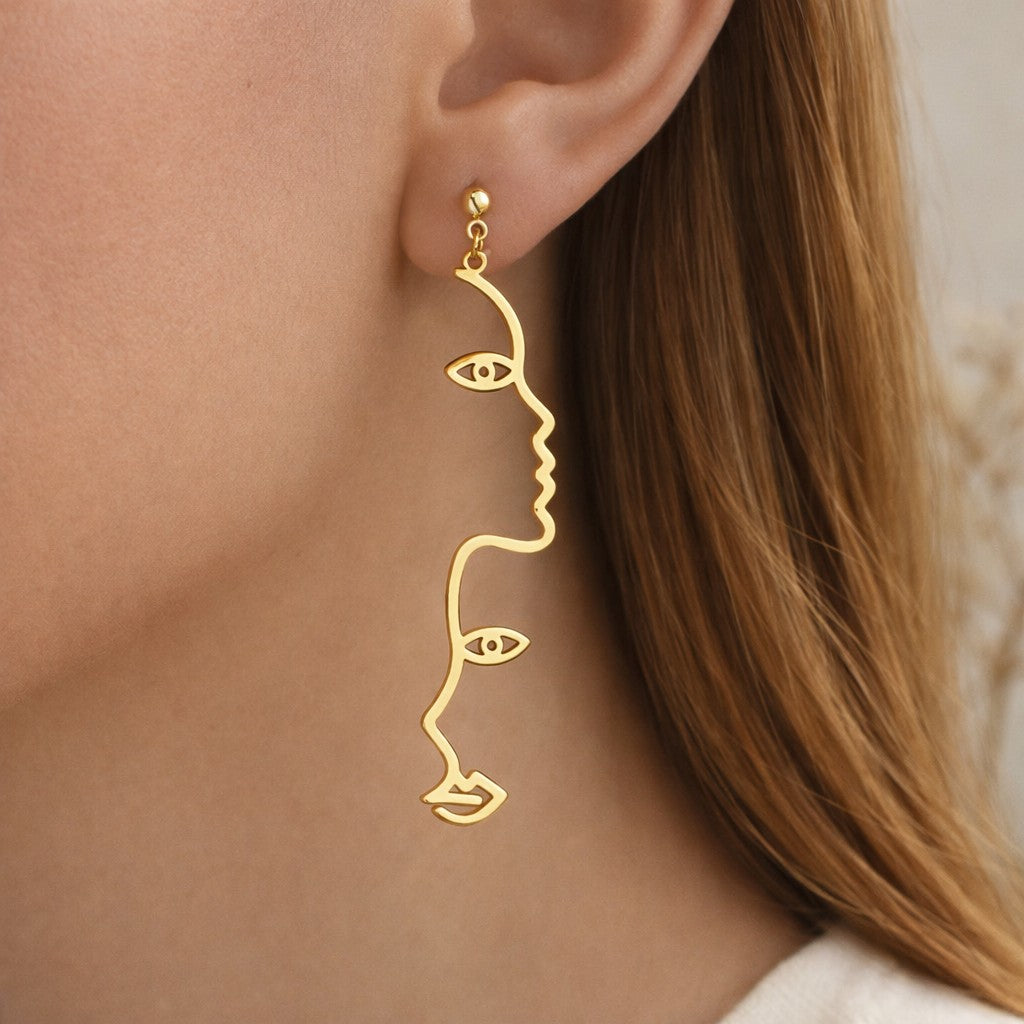 Boucles d’oreilles visage line art dorées longues minimalistes 7 cm