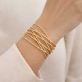 Bracelet manchette ouvert doré femme multi rangs design minimaliste
