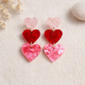 Boucles d’oreilles cœurs pendantes rose et rouge à trois cœurs superposés