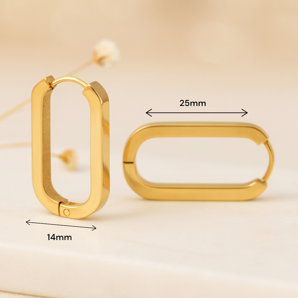 Boucles d oreilles géométriques dorées portées avec tenue chic minimaliste pour femme
