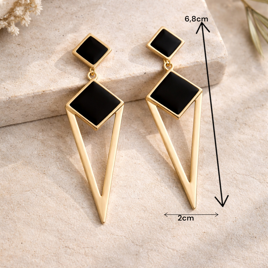 Boucles pendantes élégantes noir et or portées pour une tenue de soirée