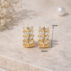 Boucles d’oreilles végétales dorées style élégant et minimaliste